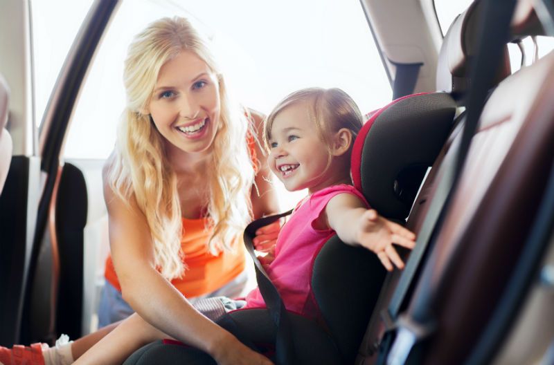 Modern convertible car seat properly installed in family vehicle showing rear-facing configuration