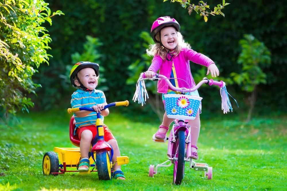 Child wearing properly fitted bike helmet and safety gear