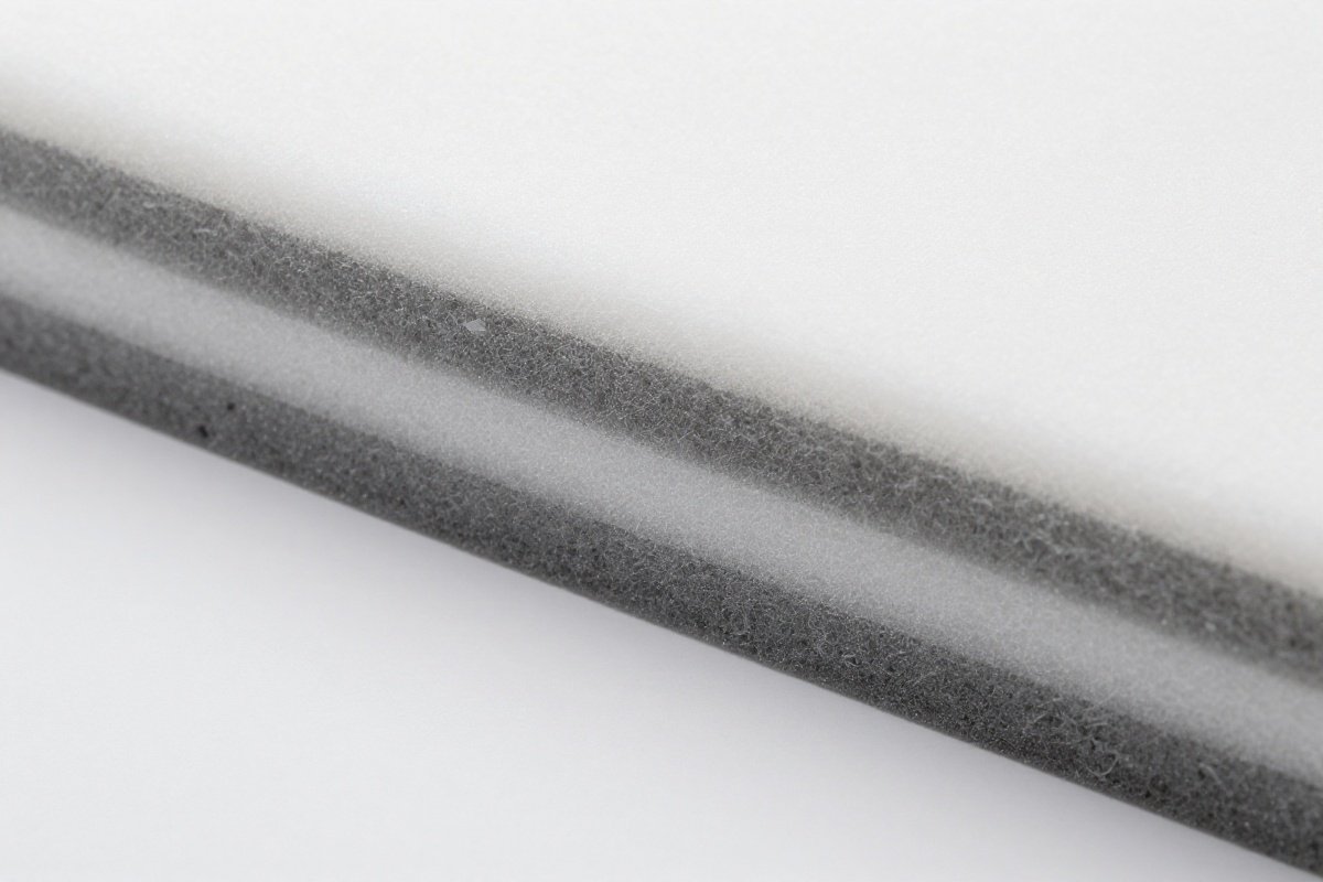Cross-section of multi-layer impact-absorbing foam used in car seat construction