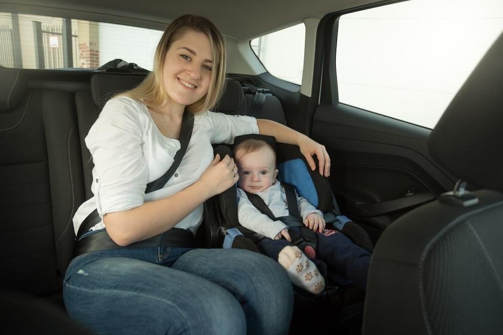 Family using Uber with properly installed car seat